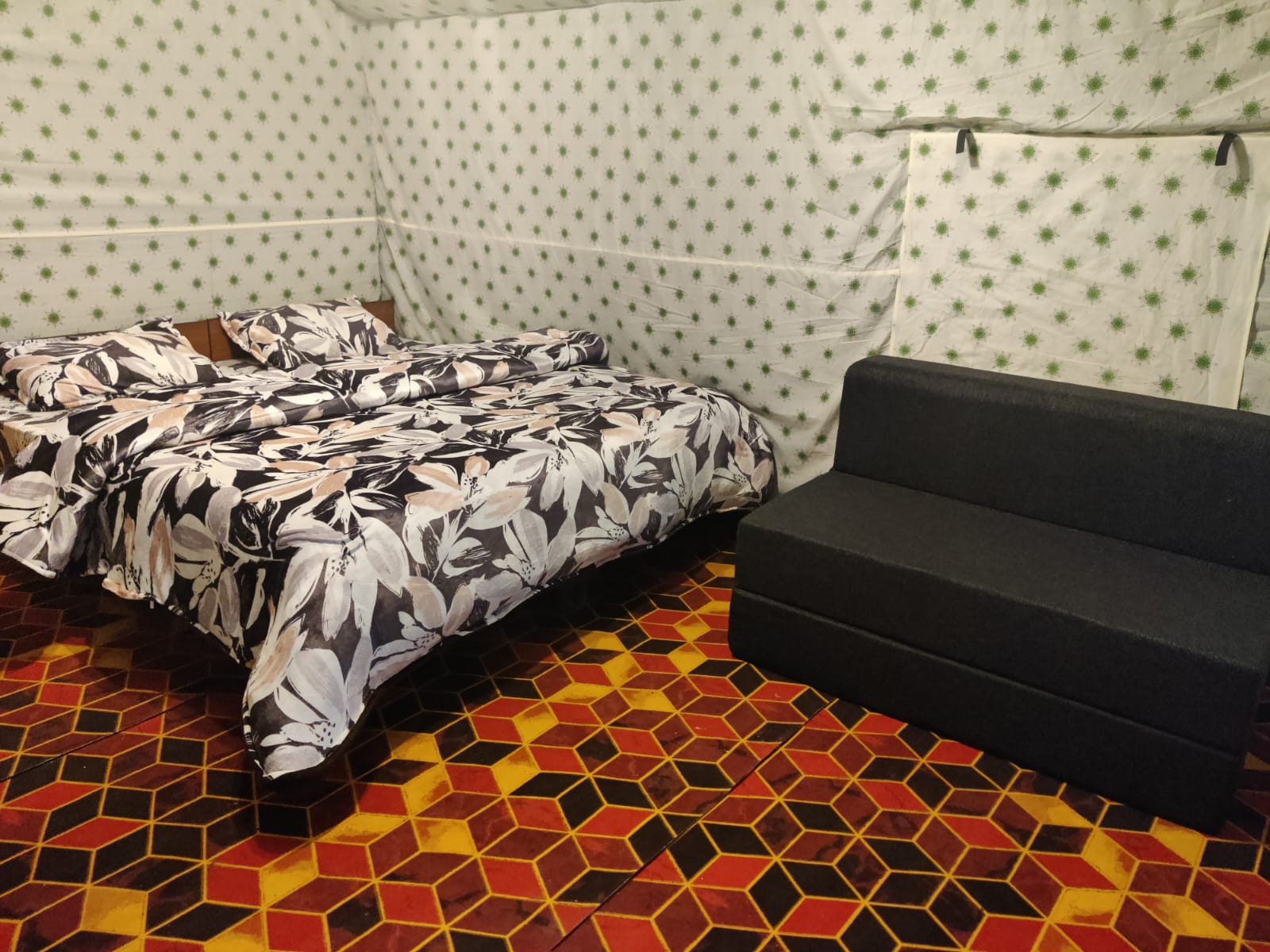 Interior view of a Kasol camp room with a double bed